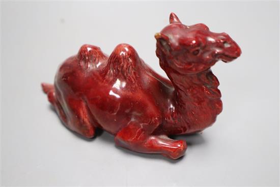 A Doulton style flambe figure of a camel, length 13cm